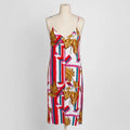 Lush striped leaf print slip dress on a dress form